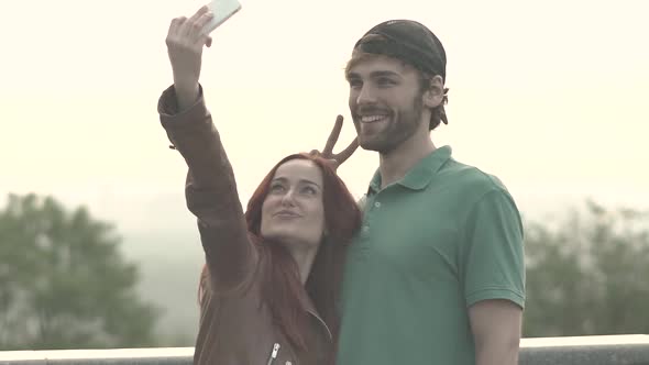 Couple Makes Selfie on a Smartphone. Slow Motion