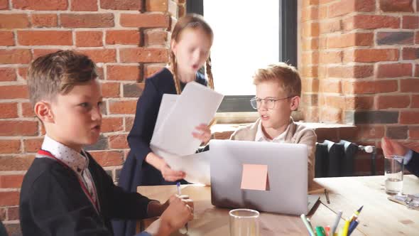 Ginger Boy Giving Advice To a Secretary While His Colleague Making Notes in the Foreground