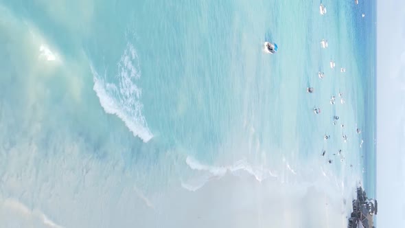 Vertical Video Boats in the Ocean Near the Coast of Zanzibar Tanzania Aerial View