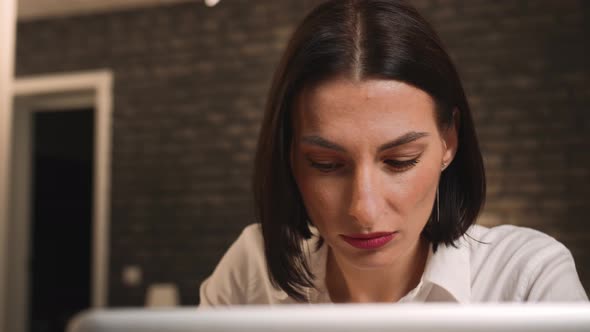 Portrait of Pretty Caucasian Woman Working on Laptop