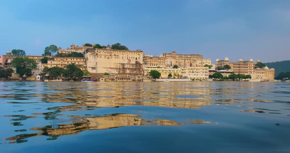 Udaipur City Palace on Lake Pichola with Tourist Boat - Rajput Architecture of Mewar Dynasty Rulers