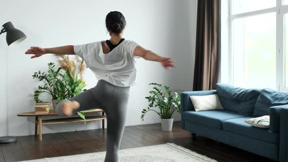 A Young Indian Woman Is Engaged In Ballet, Doing An Exercise Of Spinning on One Leg