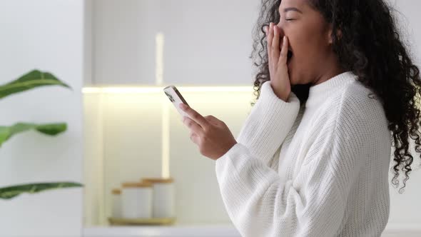 African American Girl Using Smartphone at Home Pressing Finger Reading Social Media Internet Typing