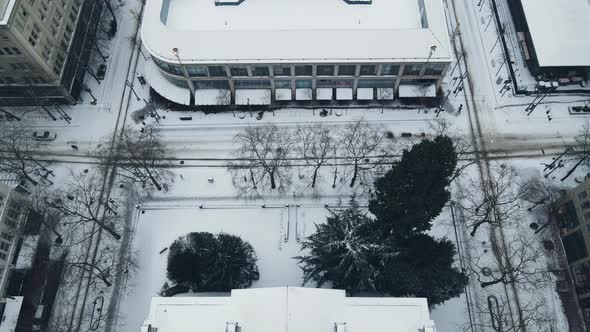 Flying Over Snow Covered Buildings During Winter in Portland Oregon