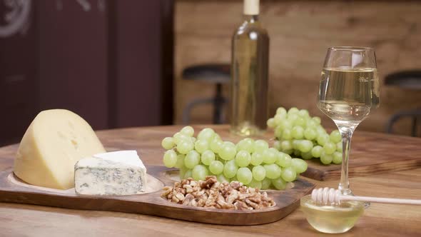 Variety of Luxury Cheeses on a Wooden Board Food Art Composition