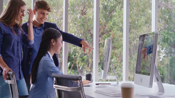 Businesswoman and Businessman Having Conversation in Modern Office