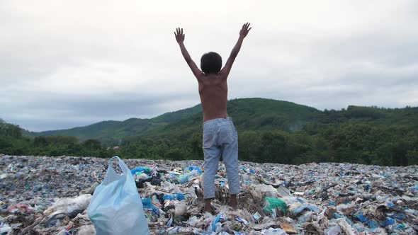 Poverty Boy Standing On Garbage Dump