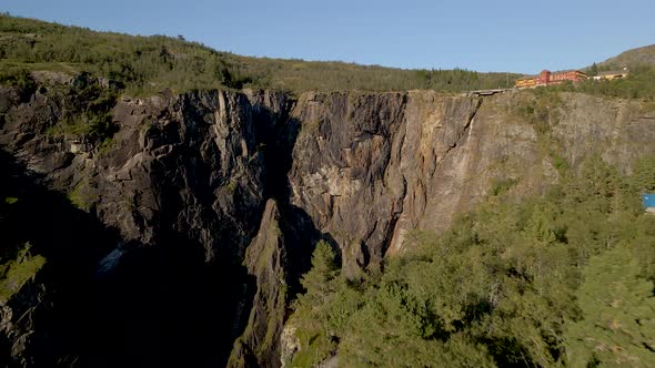 Cinematic aerial reveal of dramatic Voringsfossen falls, Norway