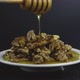 Nuts are poured with honey. - VideoHive Item for Sale