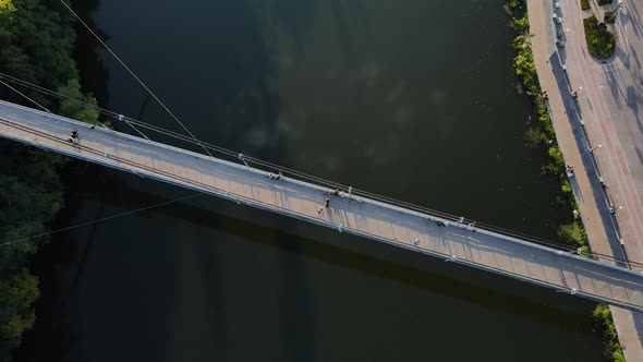 Aerial Shot The City Zhytomyr. Pedestrian Suspended Bridge Through The R. Teteriv. Ukraine