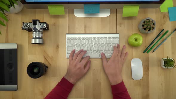 Man Hands Working On Computer Keyboard And Eating Apple Flat Lay