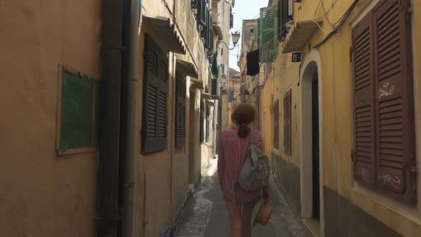 Tourist Woman Walking By The Streets Of Old City Of Kerkyra 2