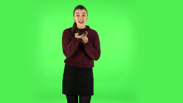Girl Asks for Information on the Network Via Phone on Green Screen