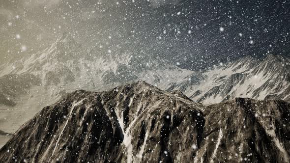 Heavy Snowing, Focused on the Snowflakes, Mountains in the Background alt