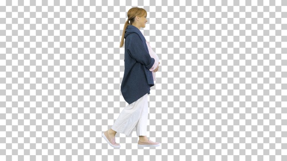 Happy pregnant blonde lady walking, Alpha Channel