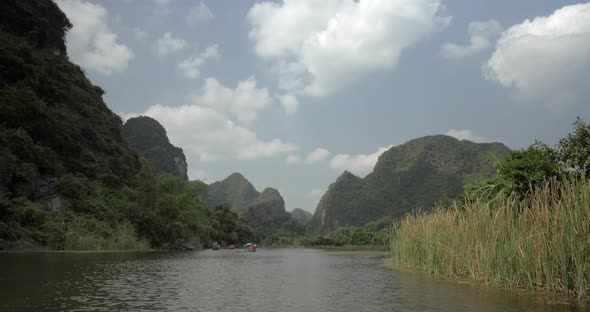 Trang an Bai in Hanoi, Vietnam on a Scenic River Sailing Boat with Tourists