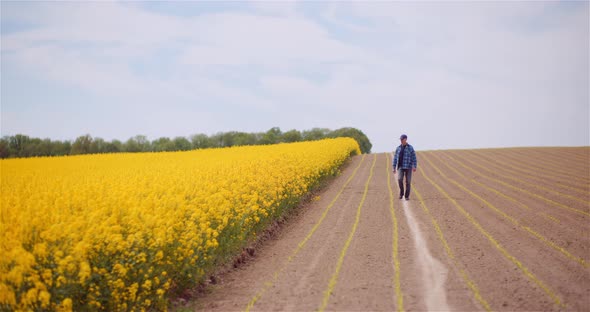 Agriculture Farmer Walking on Field.