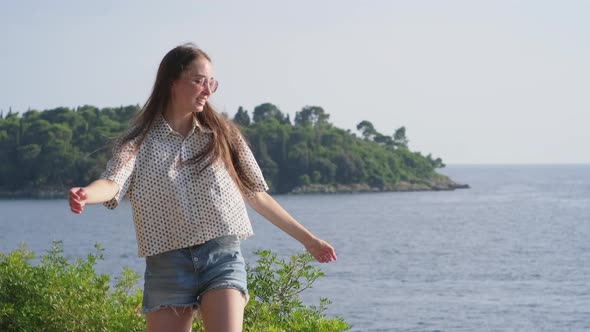 Young Happy Woman Against the Sea