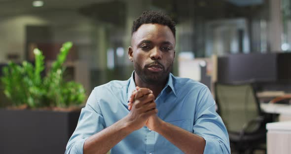 Video of focused african american businessman having video call