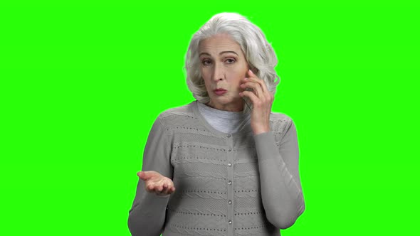 Senior Woman Talking on Futuristic Phone