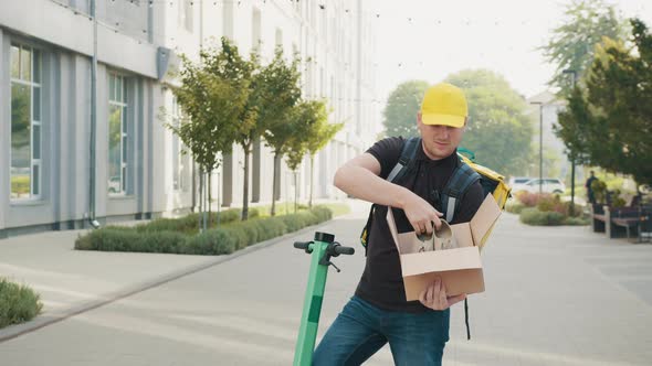 Male Courier Ride on Electronic Scooter with Box