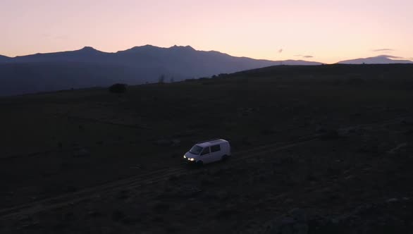Offroad Camping Van with Solar Panel at Sunset