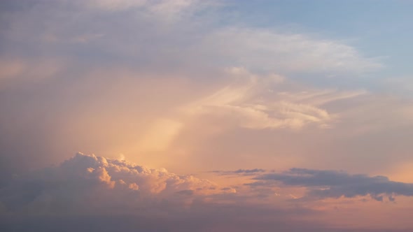 Colorful Evening Landscape with Soft Pastel Coloured Clouds on Watercolor Tinted Sunset Sky