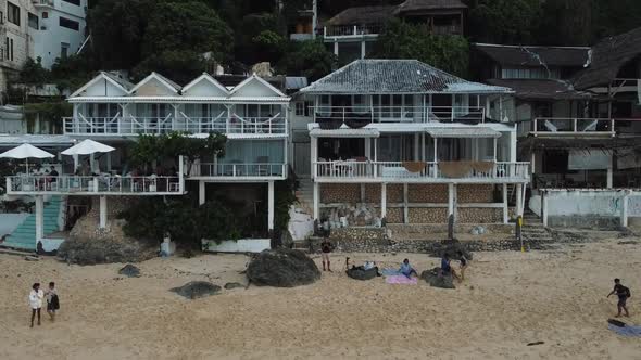 Beautiful Bingin beach with exotic cliffs houses and hotel located in Bali, Indonesia. This drone fo