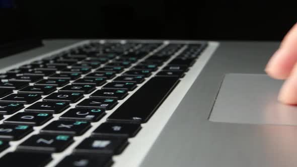 Human Hands Working on Laptop, Close Up, Cam Moves To the Right, Black