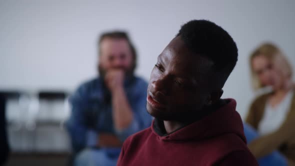 Upset African American Addict Sharing Sad Story with Group