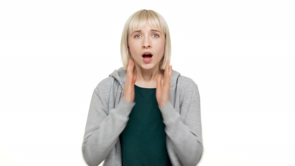 Closeup Portrait of Young Scared Woman 20s Expressing Fright Being Shocked Hearing Bad News Raising