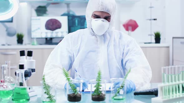 Scientific Researcher Looking at Plants Sample