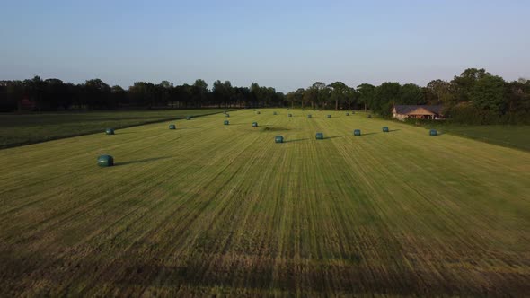 Sealed grass rolls on farmland in area the Achterhoek in the Netherlands, Aerial