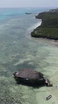 Tanzania  Vertical Video House on Stilts in the Ocean on the Coast of Zanzibar Slow Motion