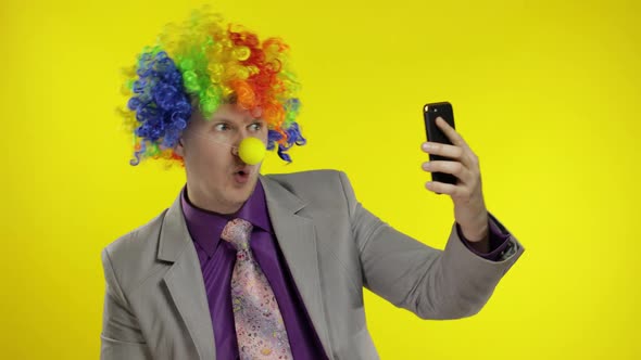 Clown Businessman Entrepreneur Boss in Wig Making Selfies Using Smartphone