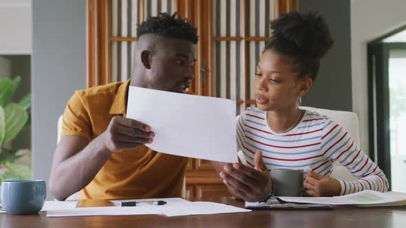 Video of focused african american couple planning home budget