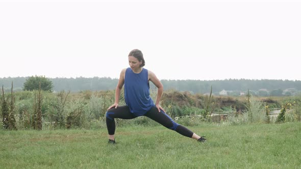 Woman stretching outdoor before running