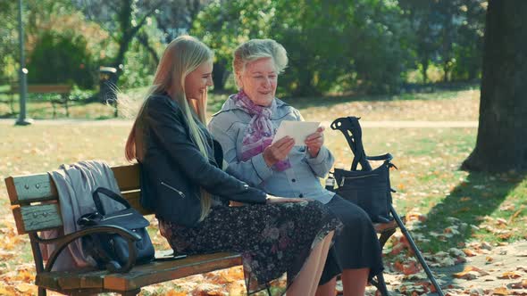 Old Woman Showing Her Pretty Granddaughter a Letter