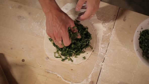 Female Hands Put Chopped Herbs Into Rolled Dough Armenian Pizza-Qutab Baking