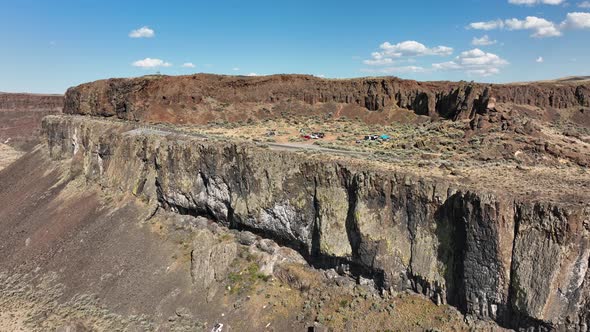 Orbiting aerial of cliffs in the Washington desert region.