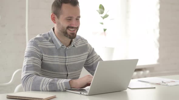 Adult Young Man Communicating Via Video Chat