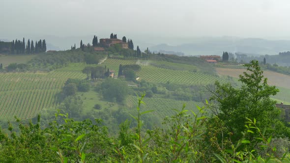 Panorama of Classical Tuscany Landscape. Hills Covered with Mist. Tuscany Is a Region in Italy