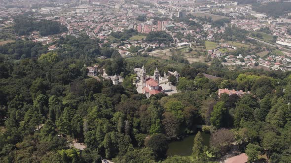 High Aerial view over Bom Jesus Sanctuary Surrounded by nature, Braga city as Background