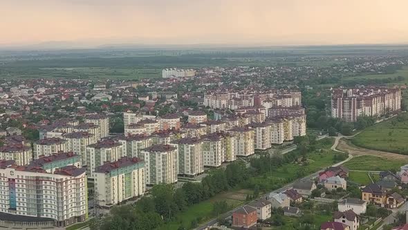 Aerial view of residential town area with apartment buildings and streets
