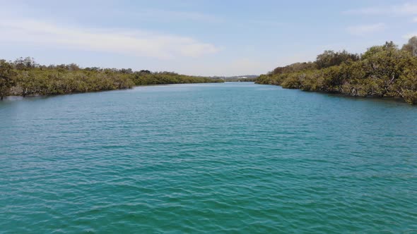 Flying Low at High Speed over the Clear Blue Water of the Hastings River at Woregore Nature Reserve