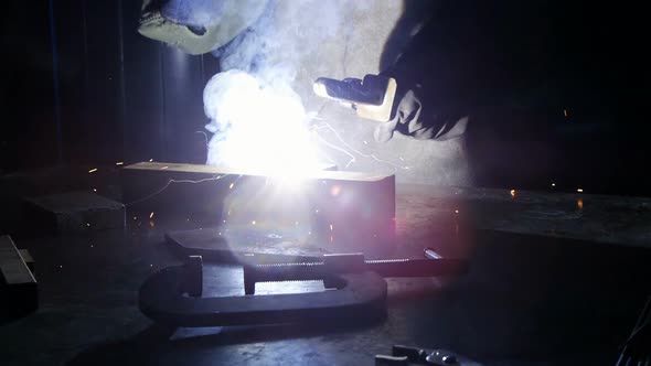 Welder welding a metal