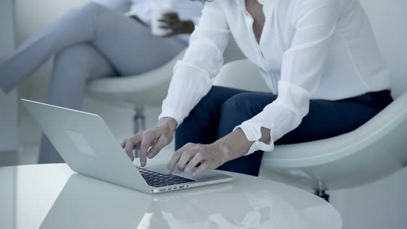 Cropped Shot of Businesswoman Using Laptop