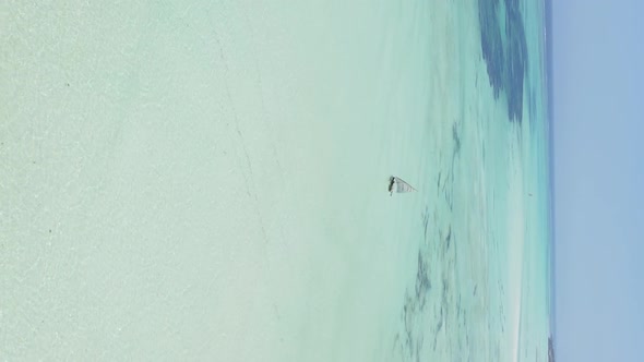 Vertical Video Boats in the Ocean Near the Coast of Zanzibar Tanzania Aerial View