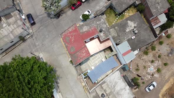 Dron flying above a school on a little village on latin america