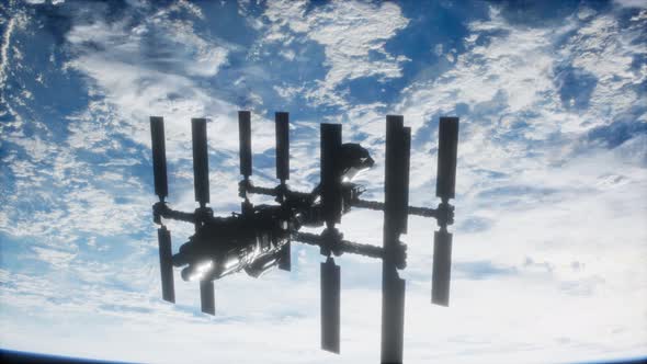 International Space Station in Outer Space Over the Planet Earth alt